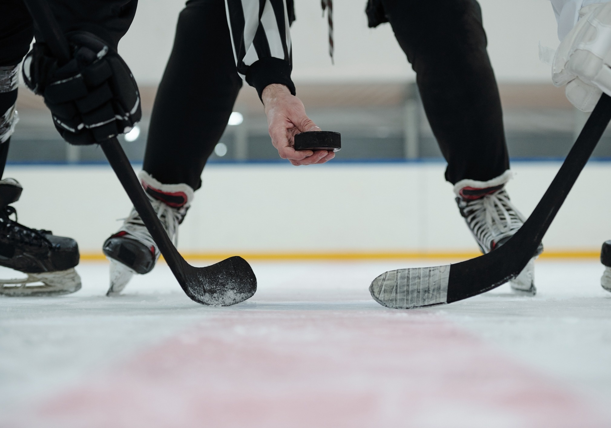 Puck drop between 2 hockey players