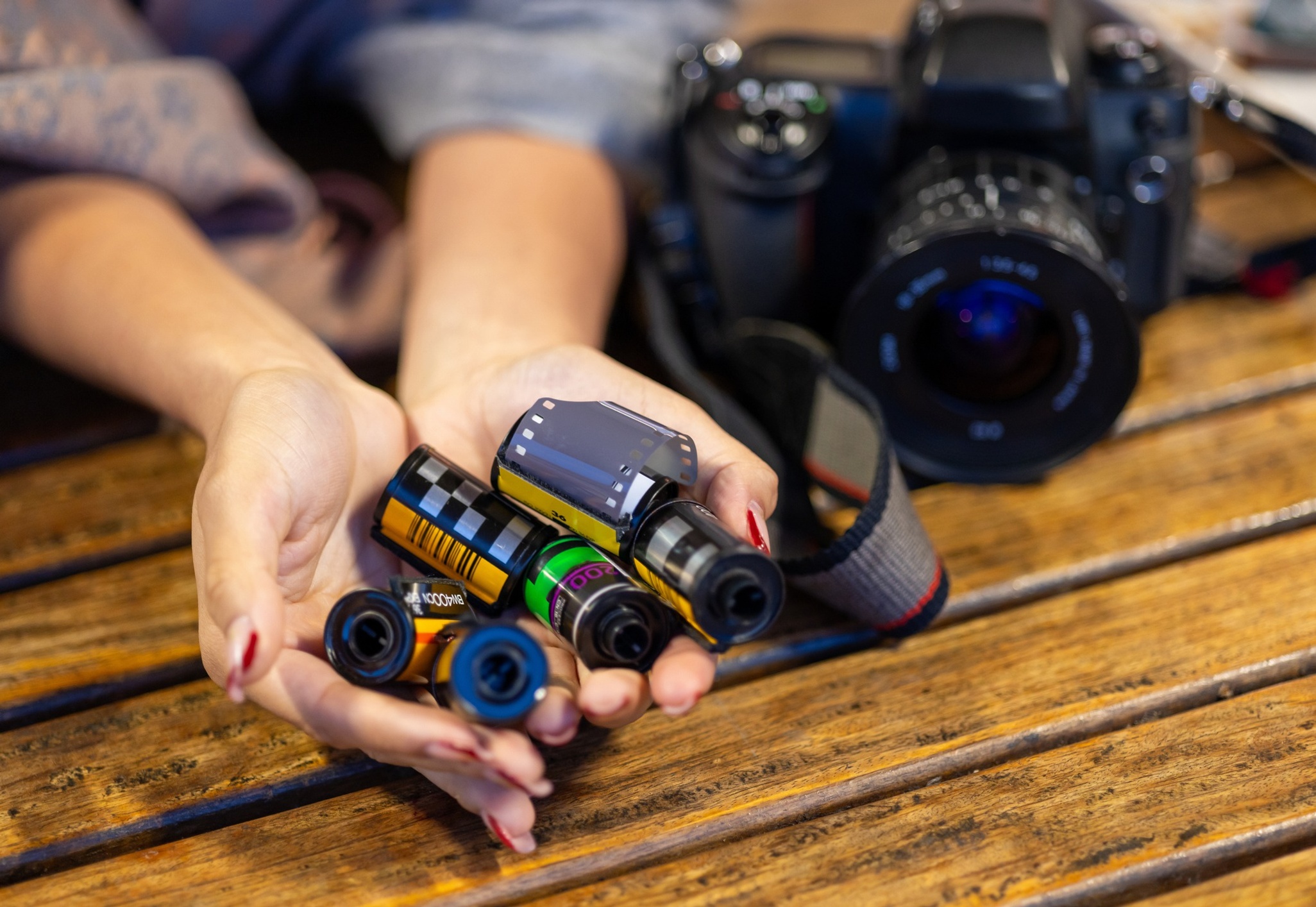 Woman holding camera film