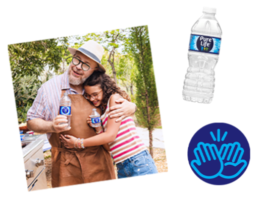 Man and girl hugging and smiling together outdoors, with a bottle of Pure Life water beside them.