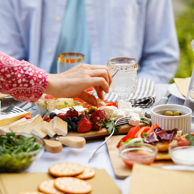 Table scene of cheese and crackers.