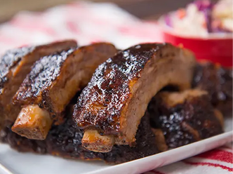 Smoked Pork Baby Back Ribs on a white plate.