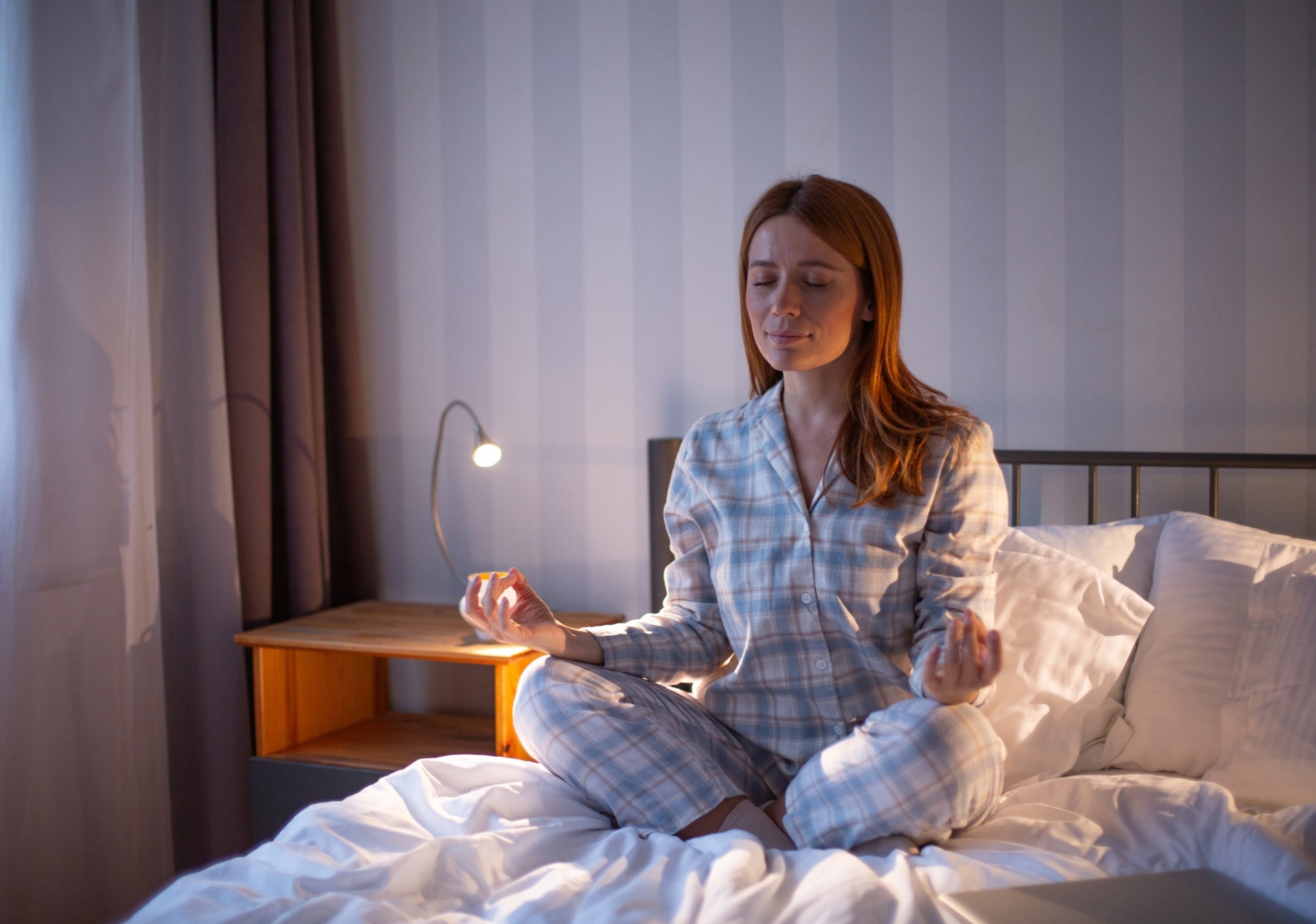 Woman mediating at bedtime