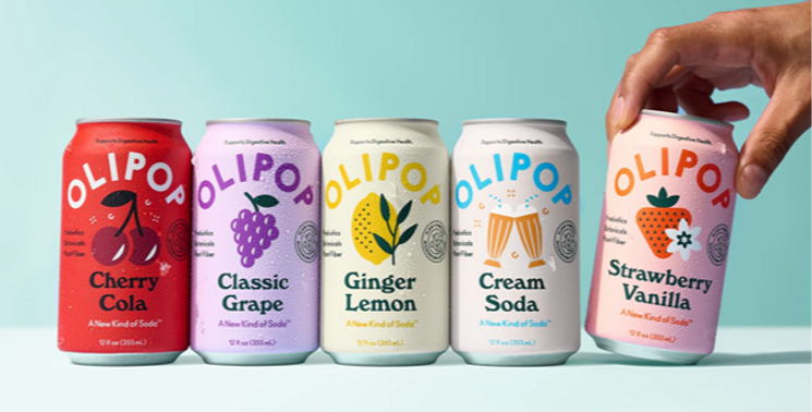 5 cans of Olipop and a hand grabbing the 5th one 
