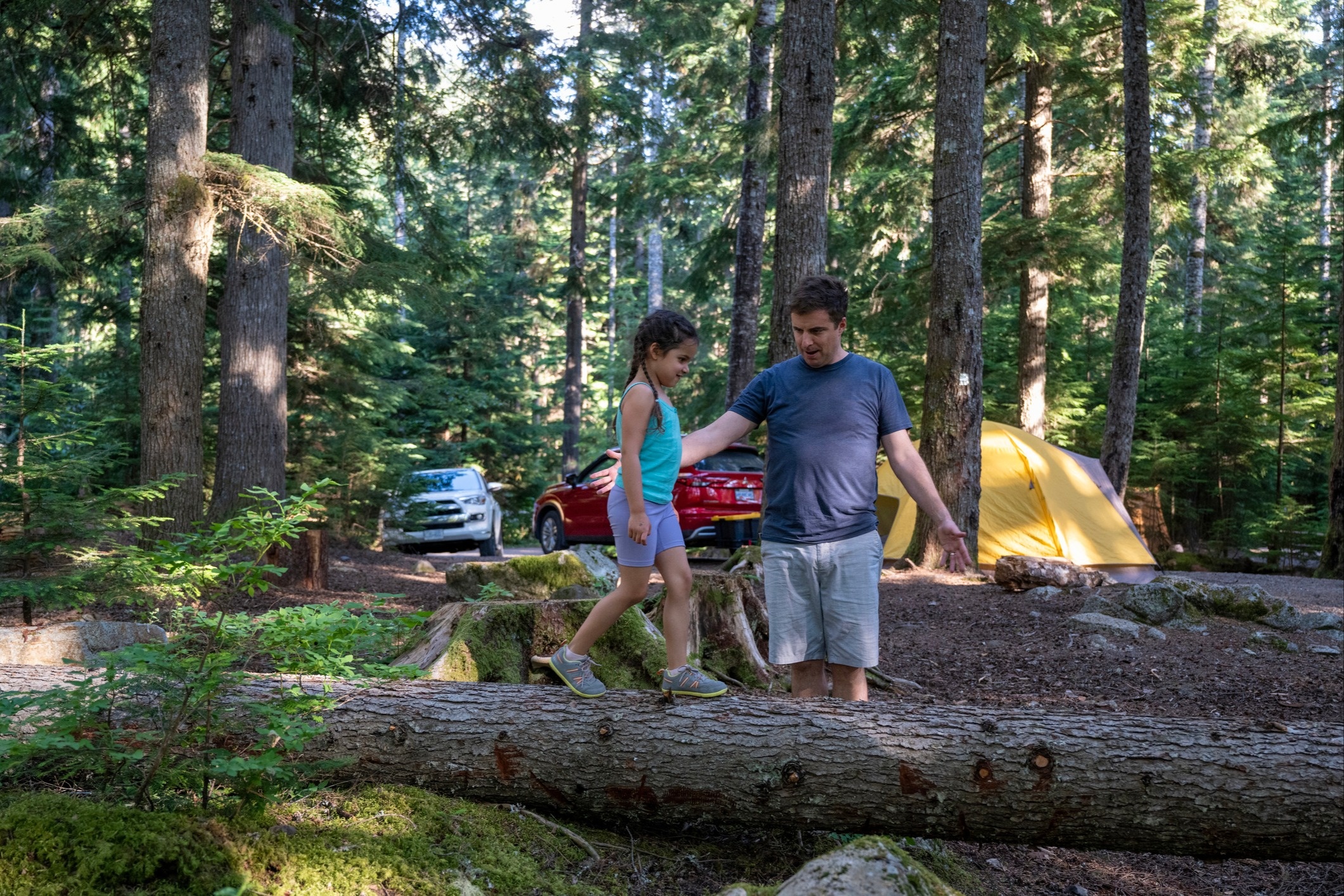 Man and child camping outdoors