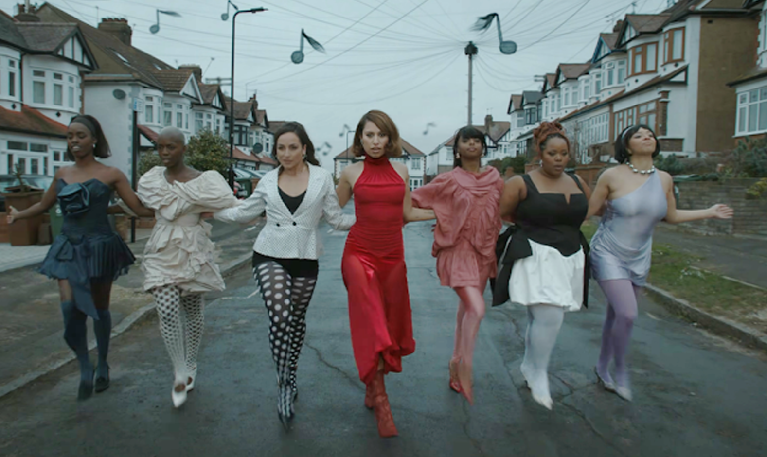 Women walking down street.