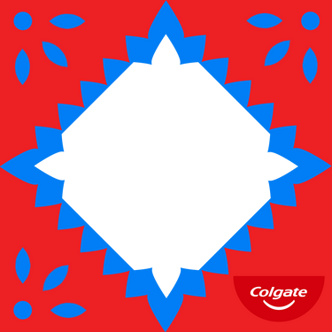 Red and blue papel picado-style frame with a white center and the Colgate logo in the bottom right corner. / Marco estilo papel picado rojo y azul con un centro blanco y el logotipo de Colgate en la esquina inferior derecha.