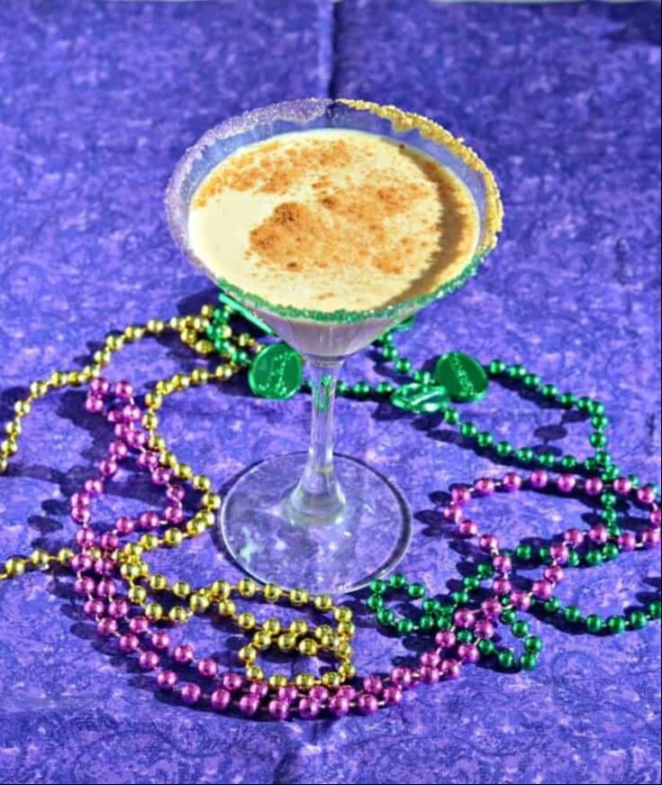 King Cake cocktail with Mardi Gras beads