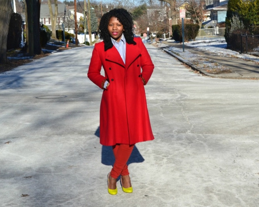 Woman wearing a long red coat