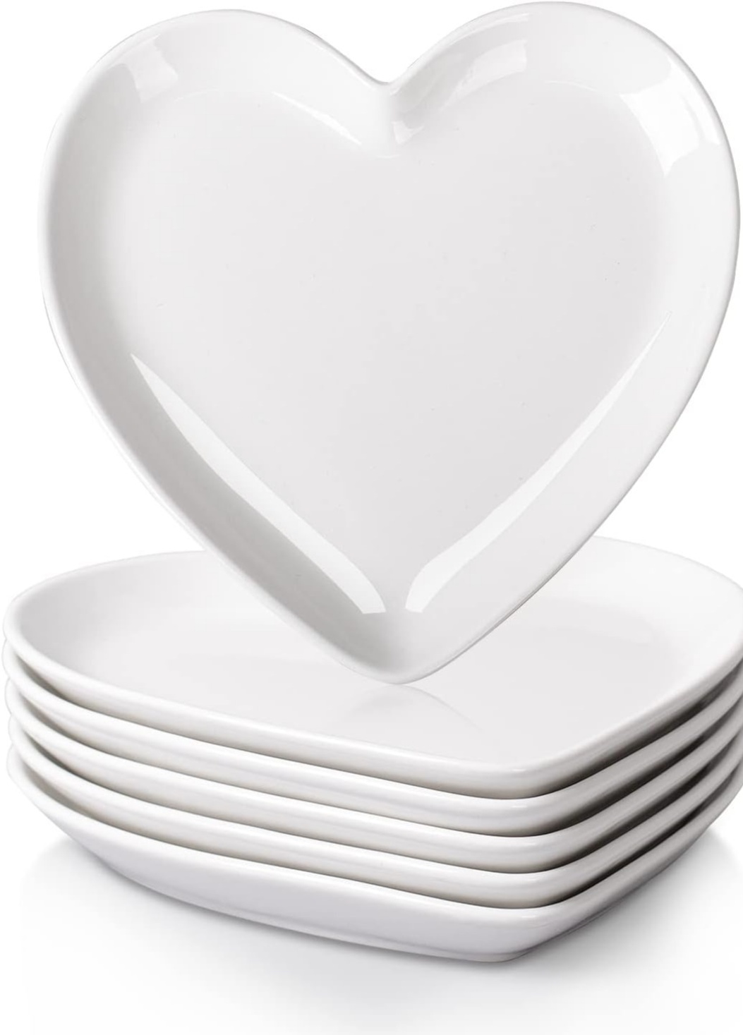 A stack of white heart-shaped plates.