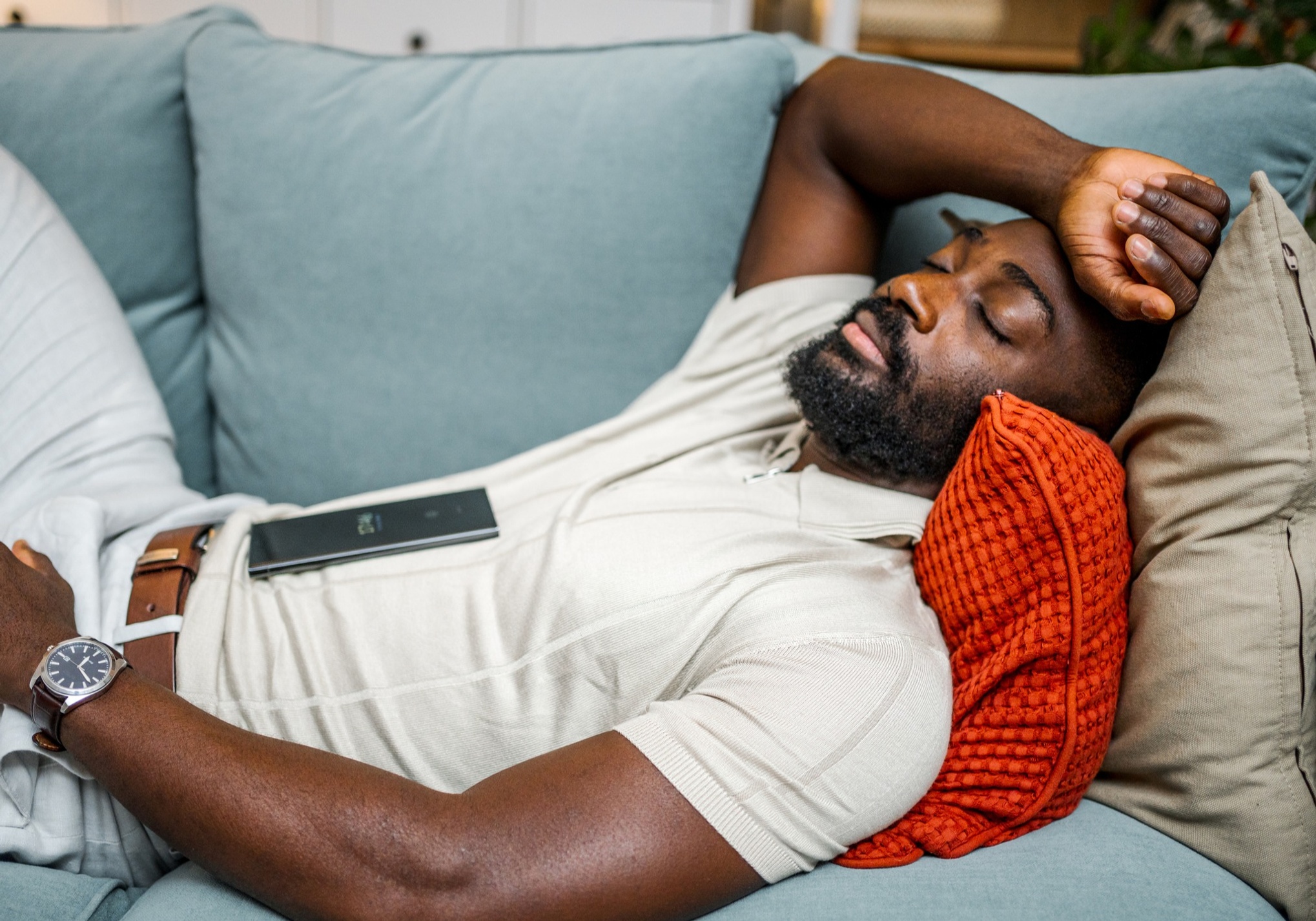 Man napping on couch