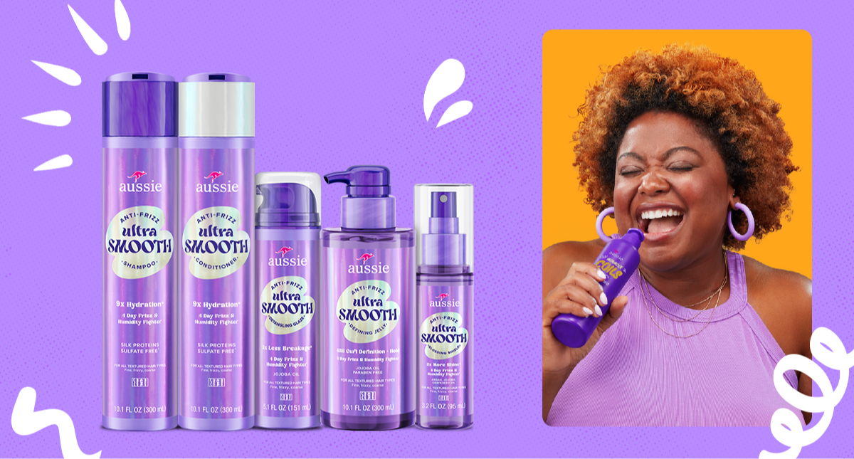 Aussie Ultra Smooth product lineup beside a laughing woman with curly hair holding a bottle.