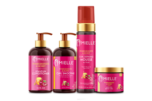 Mielle Pomegranate & Honey leave-in conditioner, curl smoothie, curl defining mousse, and edge gel lineup.