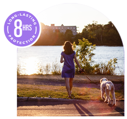 Woman walking dog at sunset with Off Clean Feel bug spray 