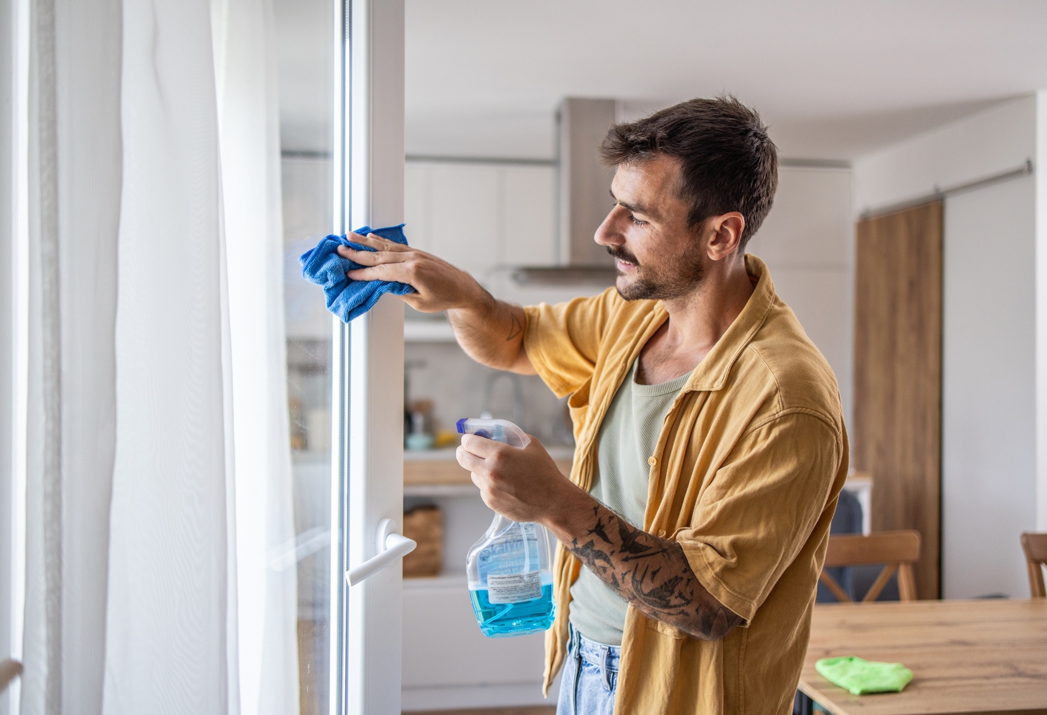 Man cleaning home