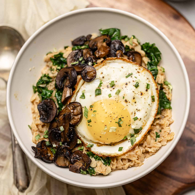 Savory breakfast oatmeal with mushrooms, miso, and a fried egg.