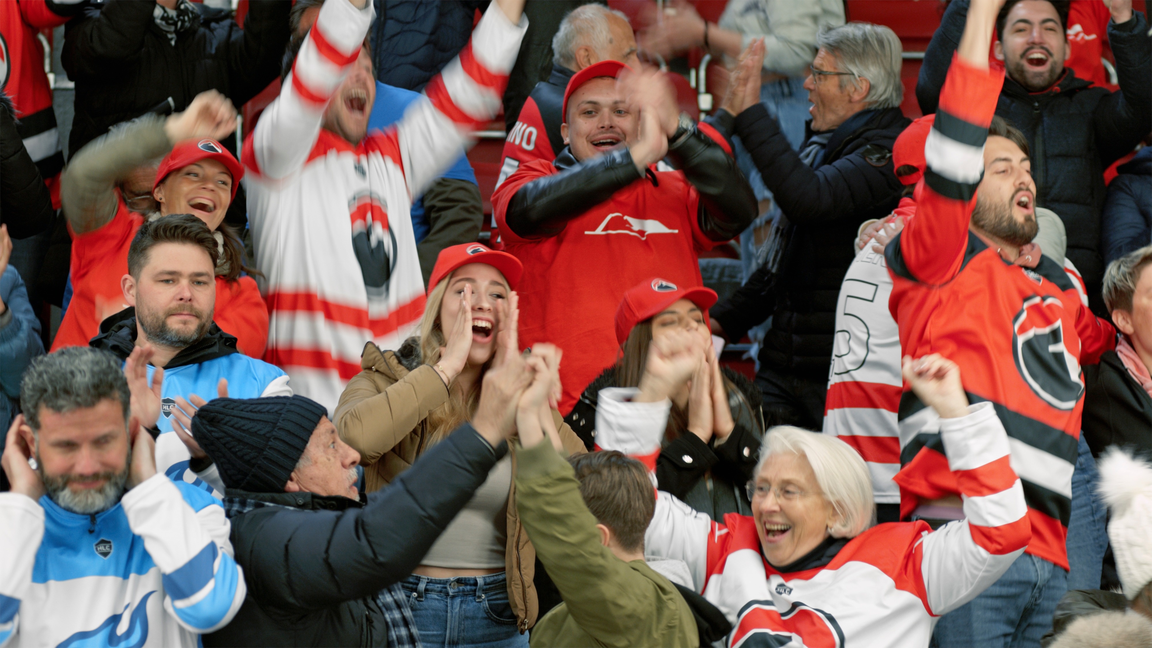 Fans cheering at a hockey game