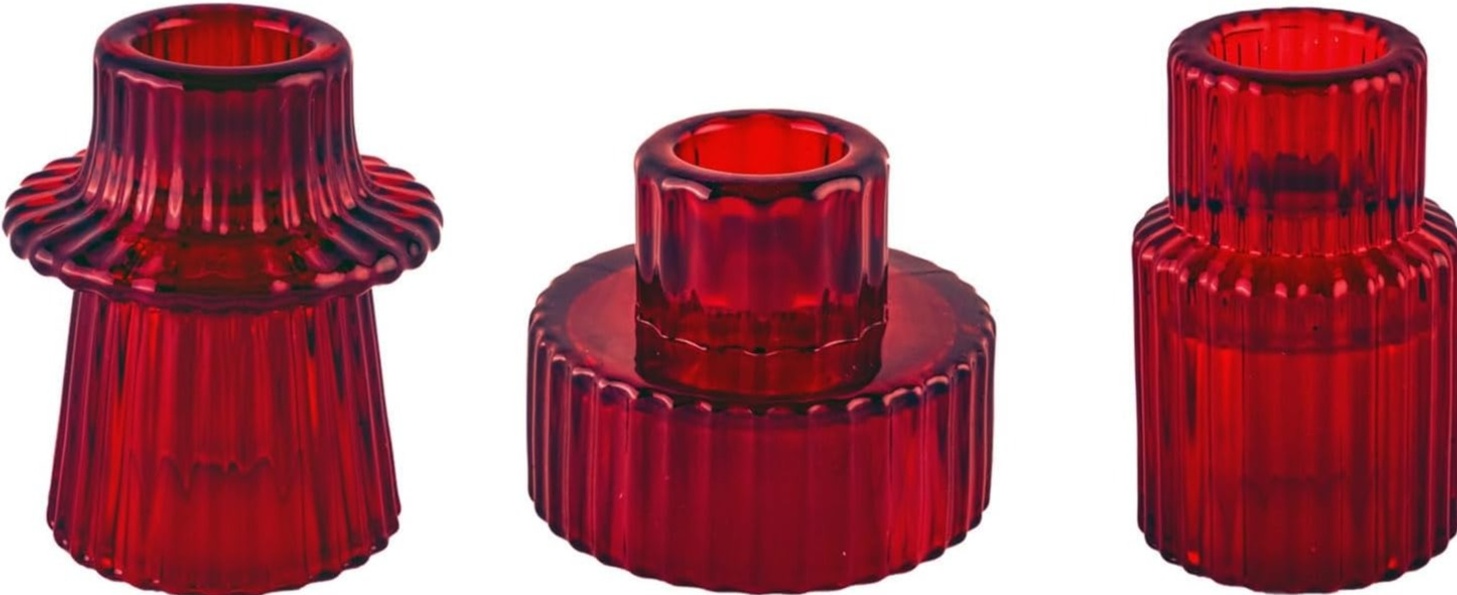 3 red glass candle holders sit on a white background