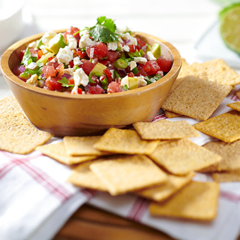 Bowl of salsa and crackers.