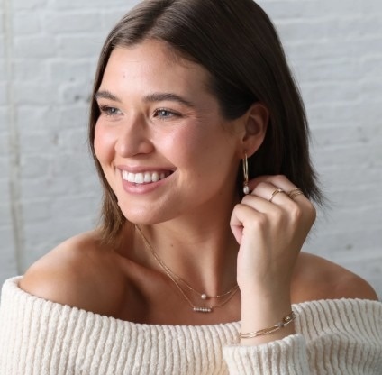 Short haired brunette with jewelry