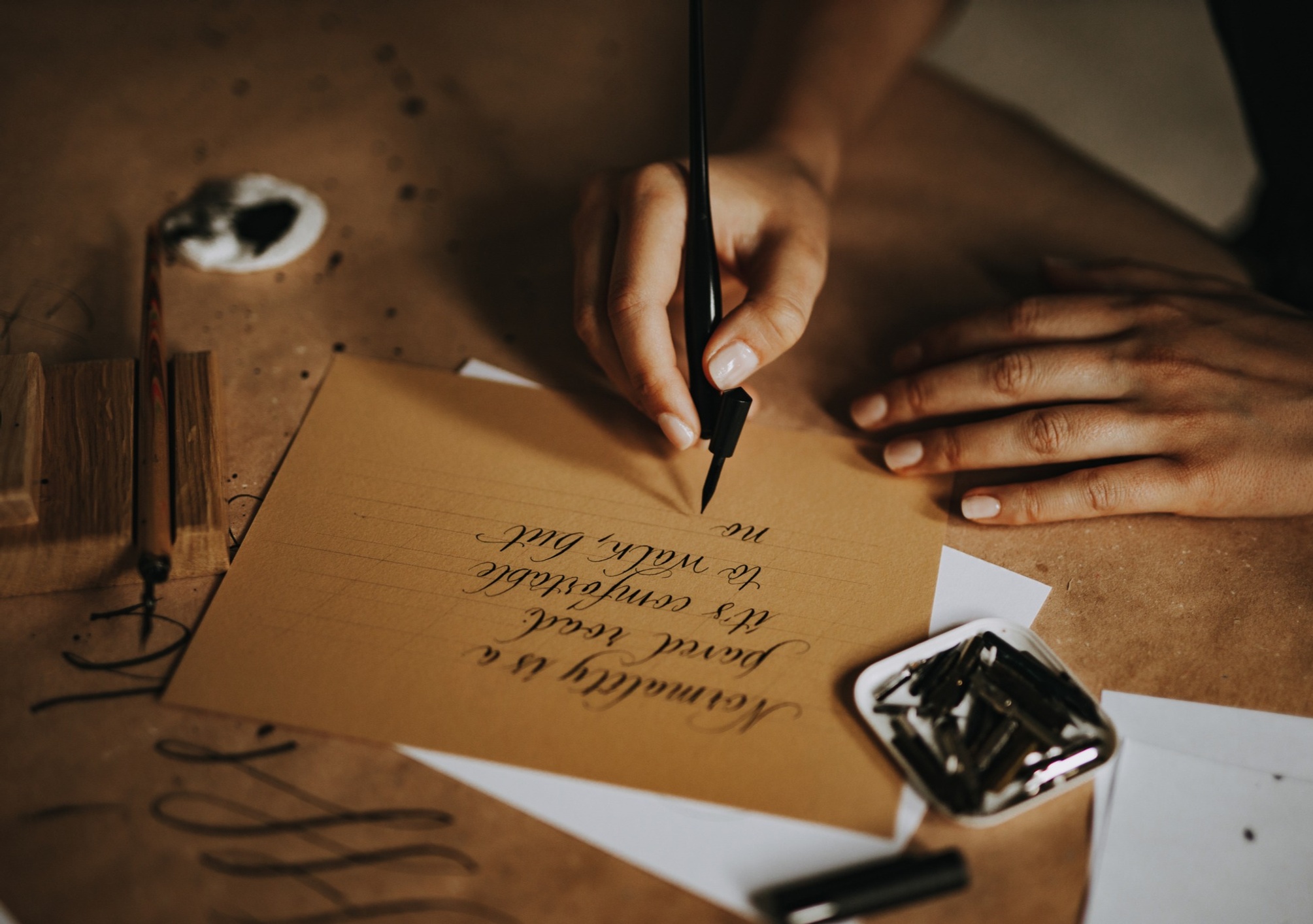 Person writing calligraphy
