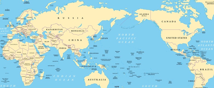 A colorful world map highlighting the continents and major oceans, centered on the Pacific Ocean.