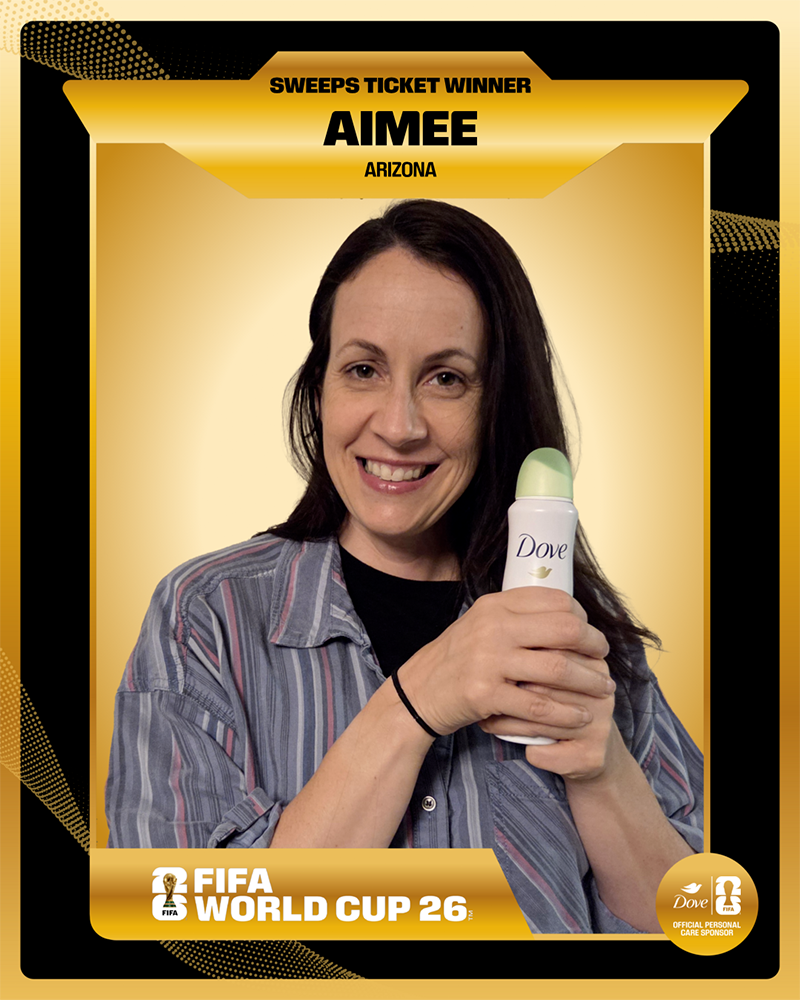 A gold digital trading card celebrating "Sweeps Ticket Winner Aimee from Arizona," featuring a smiling woman holding a Dove deodorant stick against a gold gradient background with the FIFA World Cup 26 logo.