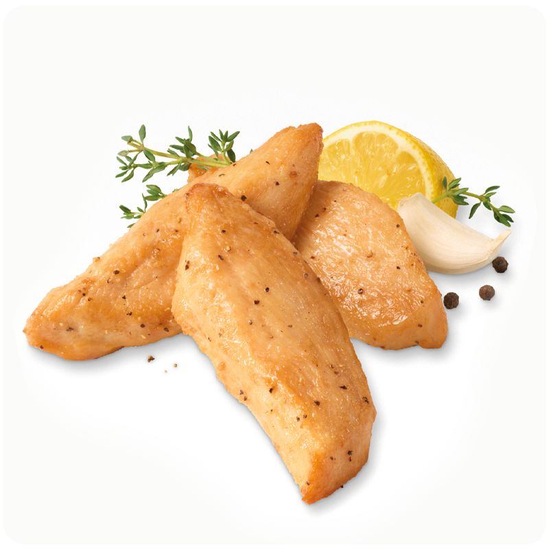 Chicken with lemon slice, garlic clove, and herbs